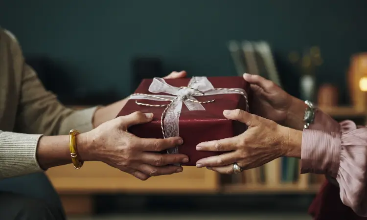 Wine tasting setup with two glasses, a bottle, and a tasting guide in a cozy kitchen environment