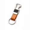 Premium leather keychain with metal carabiner and bottle opener on white background