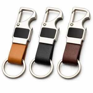 Three leather keychains with metal carabiners in different colors – tan, black, dark brown