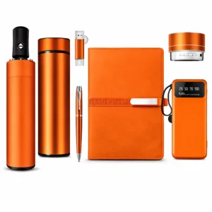 Luxury corporate gift set with portable power bank, thermos, and accessories on white backdrop