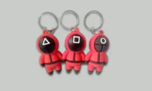 Promotional keychains on a desk with different branding options