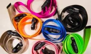 Neoprene phone lanyard holding a smartphone, highlighting its flexibility and soft texture