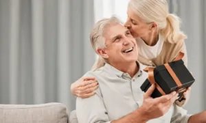 Romantic dinner setup at home with plated dishes, candles, and wine glasses